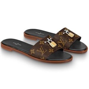 SOLD  Lock it flat Louis Vuitton mules SZ 39